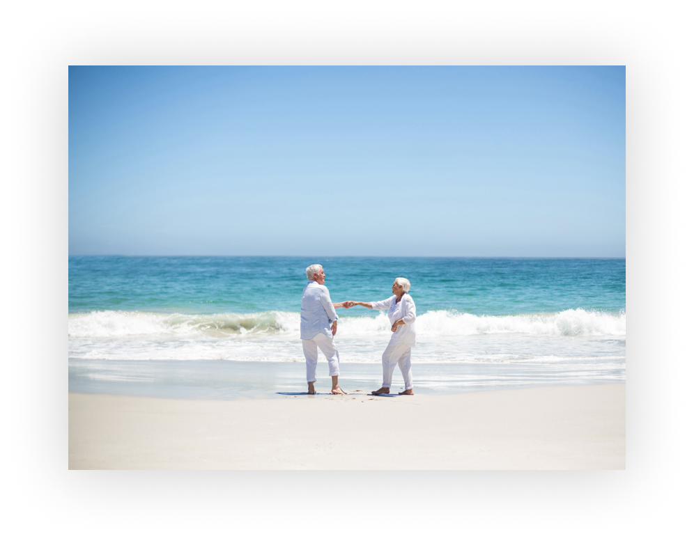 Older couple on a precious beach in Aruba