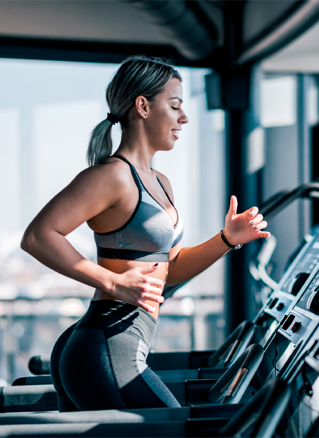 Girl exercising on a treadmill